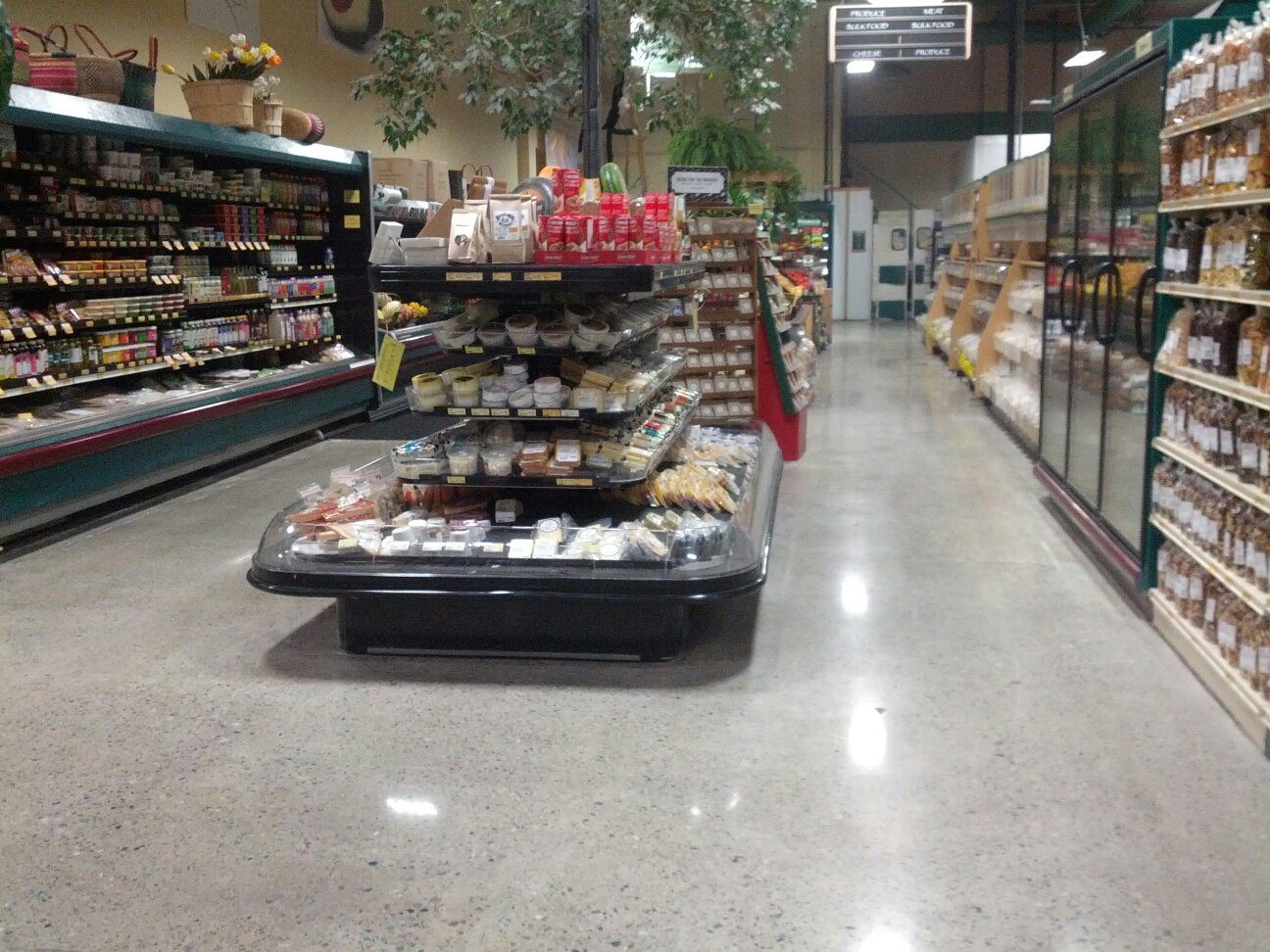 Polished concrete floor in a retail store finished by 6D Concrete Restoration