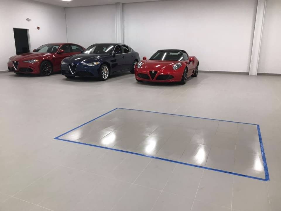 Polished concrete floor in an automotive showroom finished by 6D Concrete Restoration